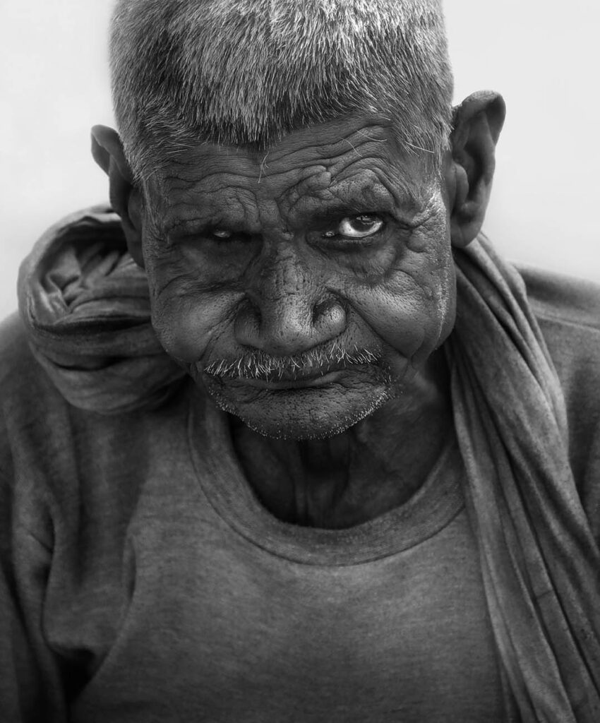 Portrait of a man Close-up portrait of an Indian man in the street, India - stock photo