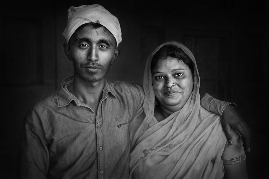 Family Portrait of an Indian mother and son hugging - stock photo