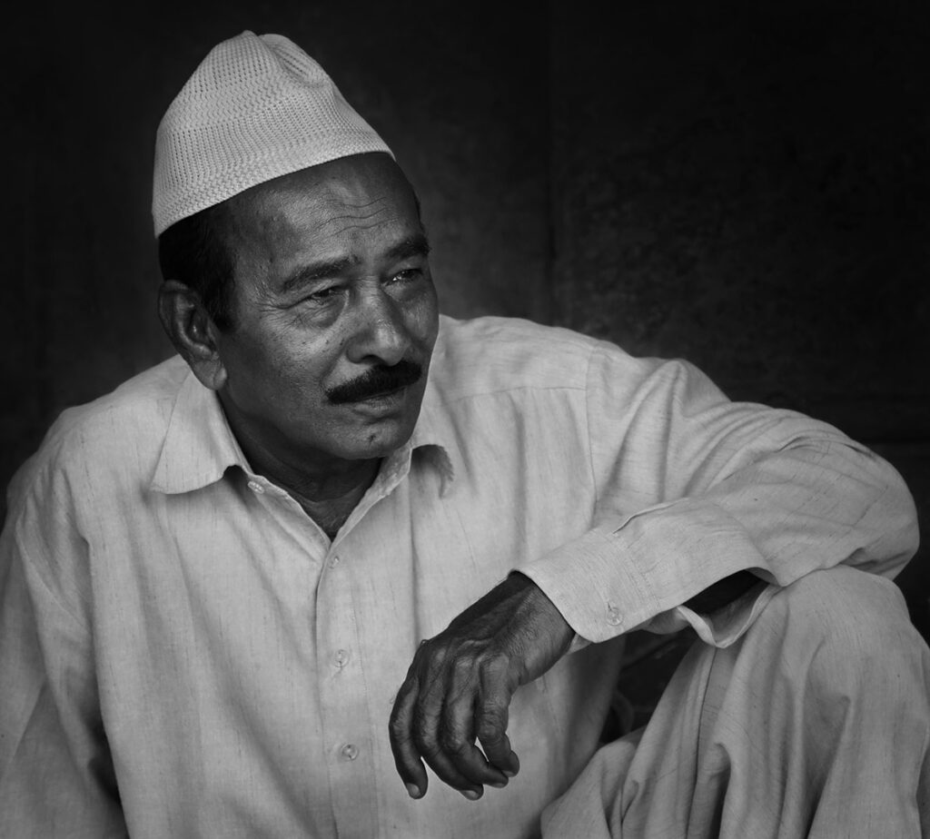 Portrait of a man Close-up portrait of an Indian man in the street, India - stock photo