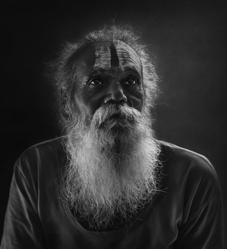Eyes Close-up portrait of Indian man, Monkey Temple, Jaipur, India - stock photo