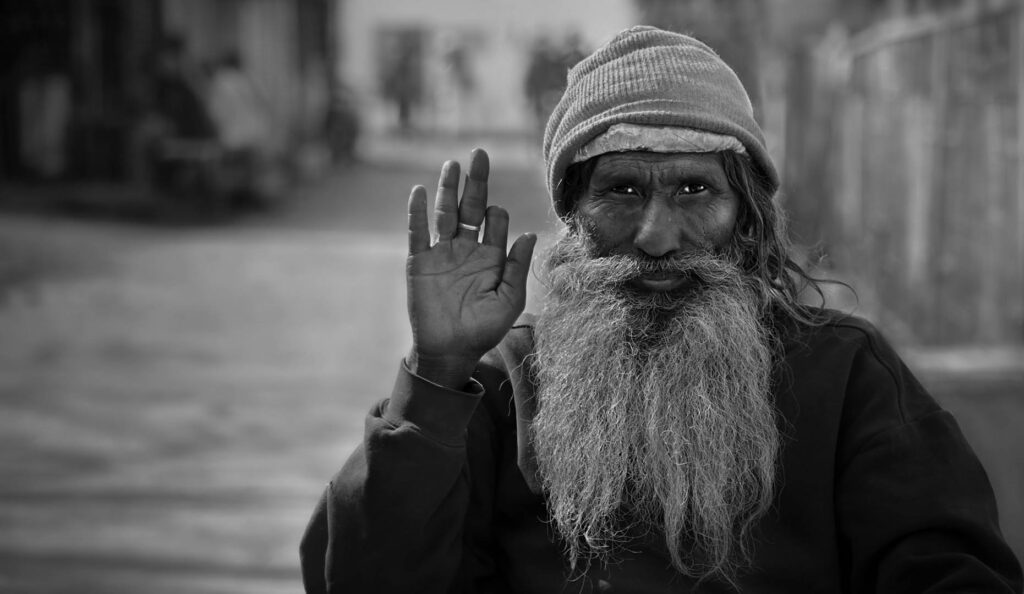 Smile Close-up portrait of an Indian man in the street, Rishikesh, India - stock photo