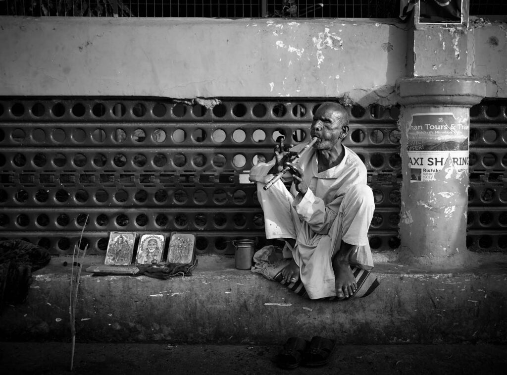 Play flute Indian musicians playing flute on the stree, India - stock photo