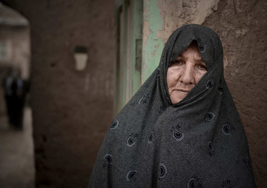 A woman Portrait of Iranian woman standing in the village - stock photo