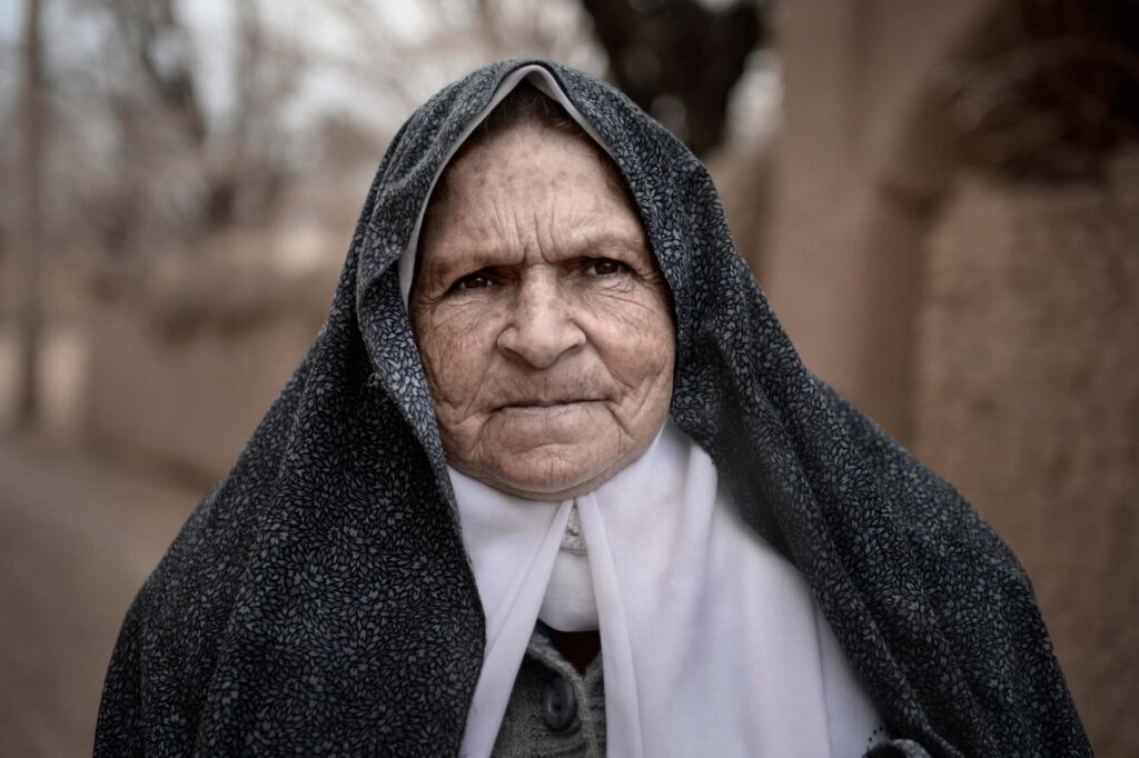 A woman Portrait of an Iranian woman wearing traditional chador in Yazd village, Iran - stock photo