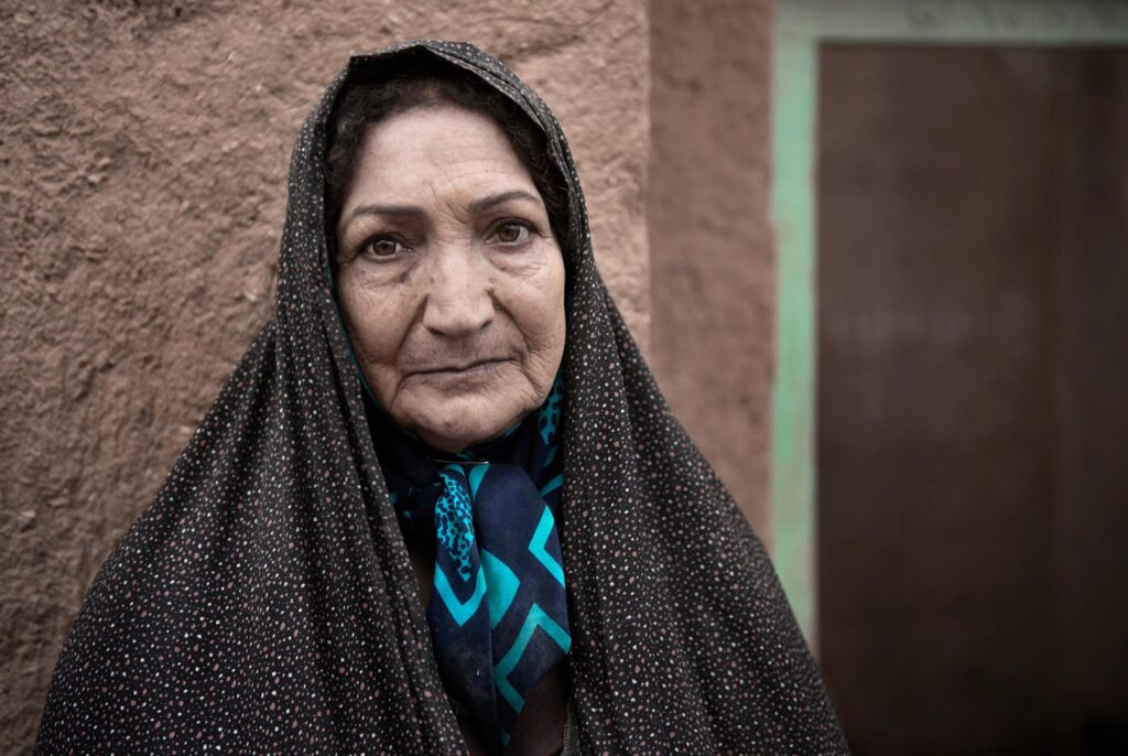 A woman Portrait of an Iranian woman wearing traditional chador in the village - stock photo